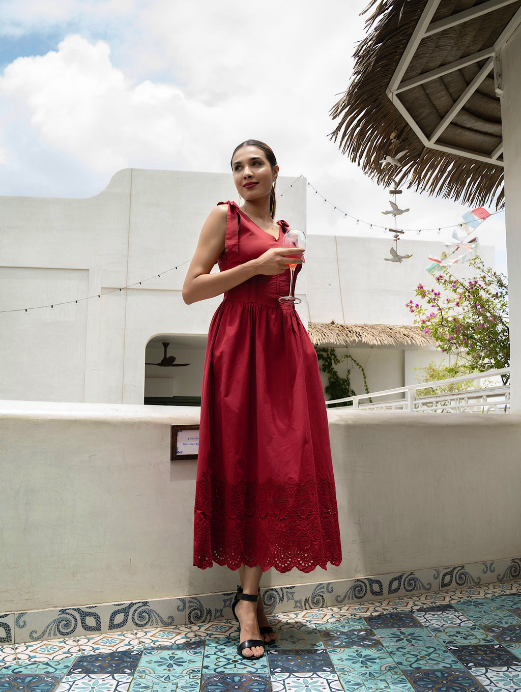 Front view of model wearing Red Cotton midi dress with tie straps, V-neck, broderie anglaise hem, and pockets-MISSVI