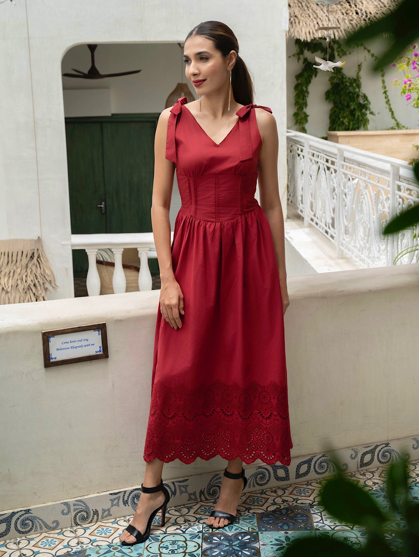 Front view of model wearing Red Cotton midi dress with tie straps, V-neck, broderie anglaise hem, and pockets-MISSVI