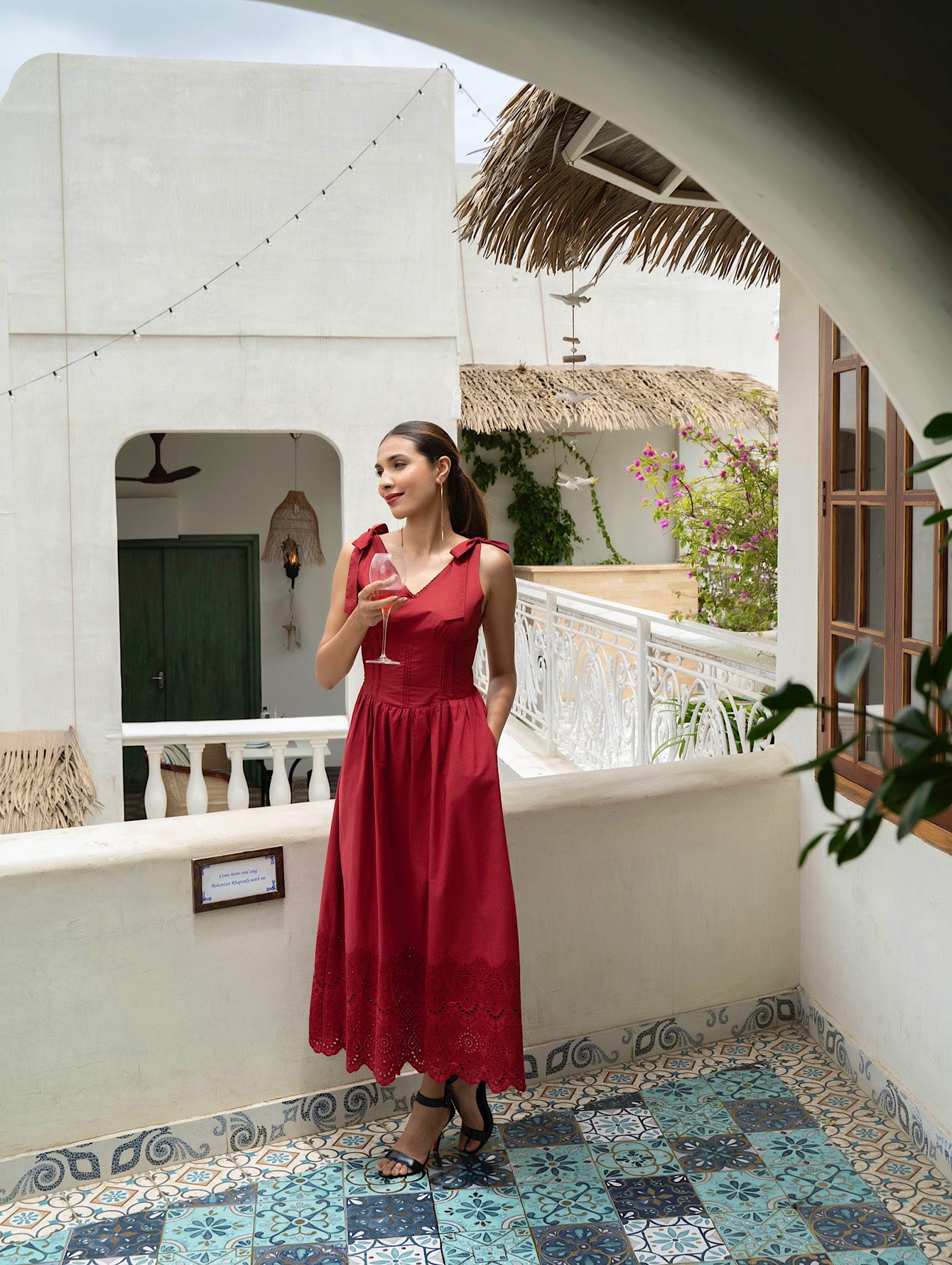 Over view of model wearing Red Cotton midi dress with tie straps, V-neck, broderie anglaise hem, and pockets-MISSVI