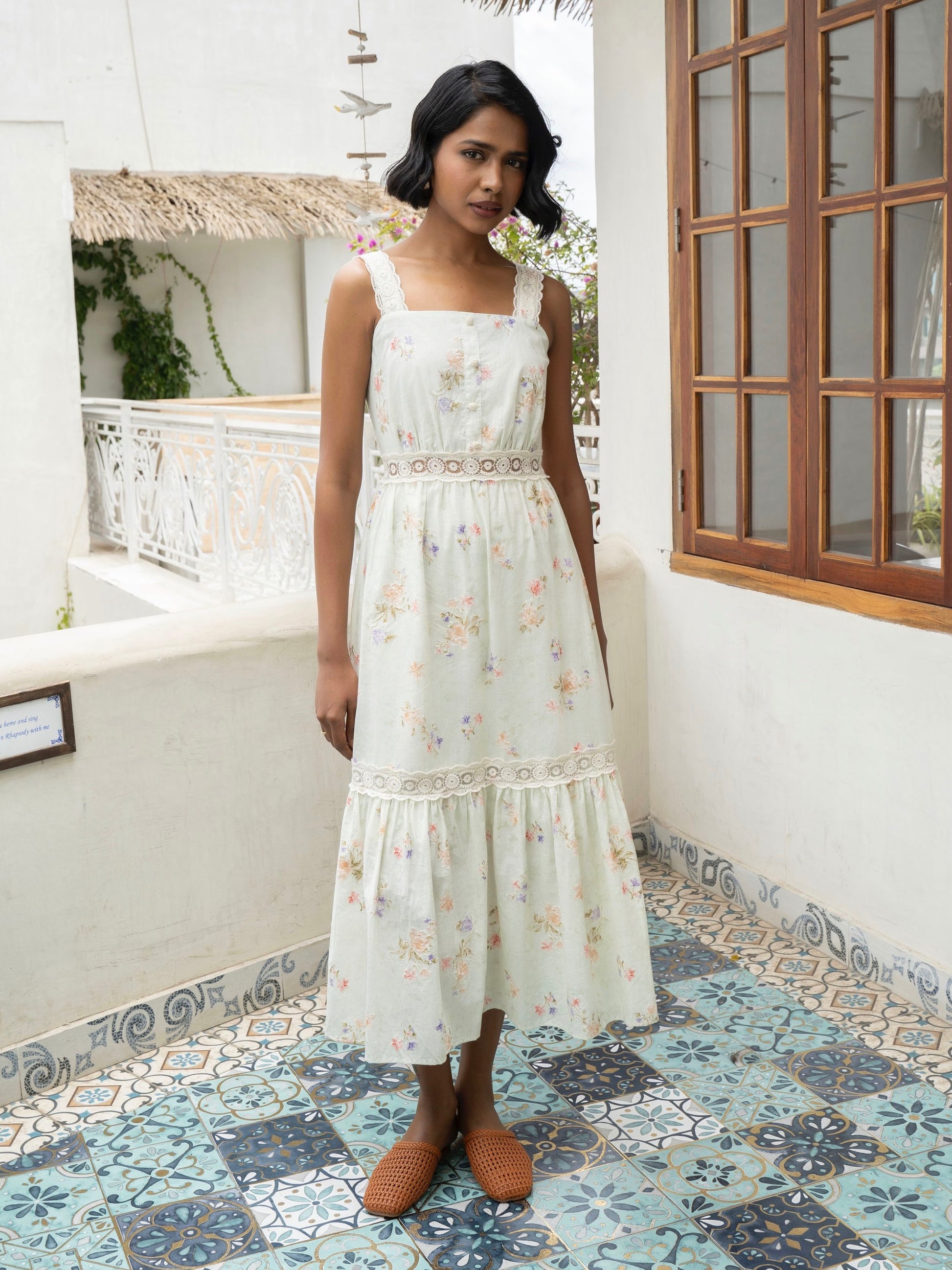 Front view of model wearing Pastel floral cotton midi with lace straps and tiered skirt-MISSVI